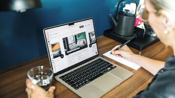 Premium bedding, desk, laptop workspace, soundproofing