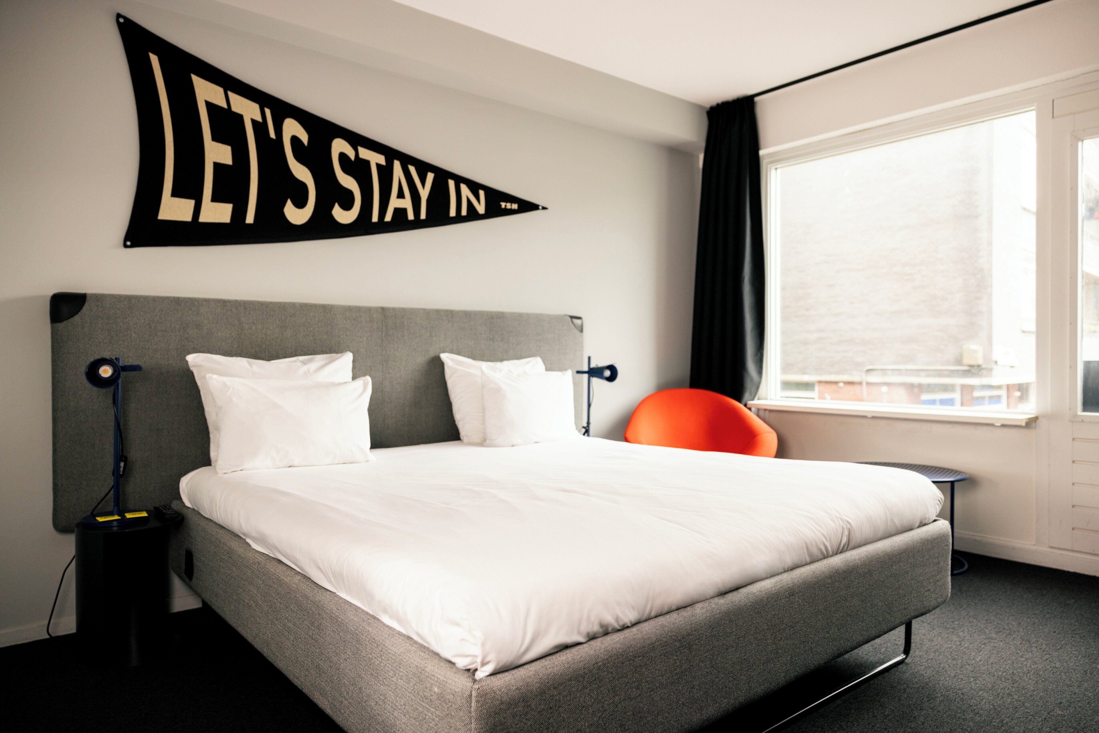 Premium bedding, desk, laptop workspace, soundproofing
