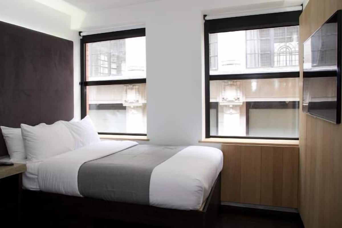Individually furnished, desk, laptop workspace, blackout drapes