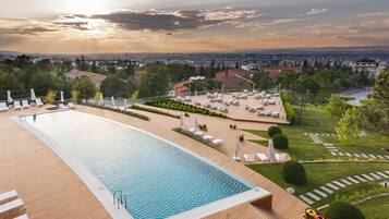 Indoor pool, outdoor pool, open 8:00 AM to 10 PM, pool umbrellas