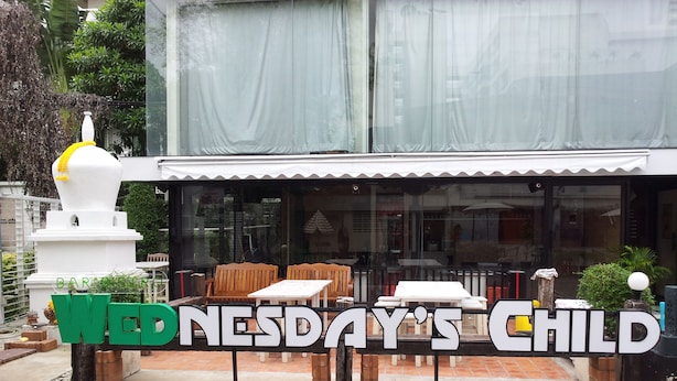 A restaurant named "Nesday's Child" with outdoor seating and a white exterior. - Himalaya Residence (Bangkok)