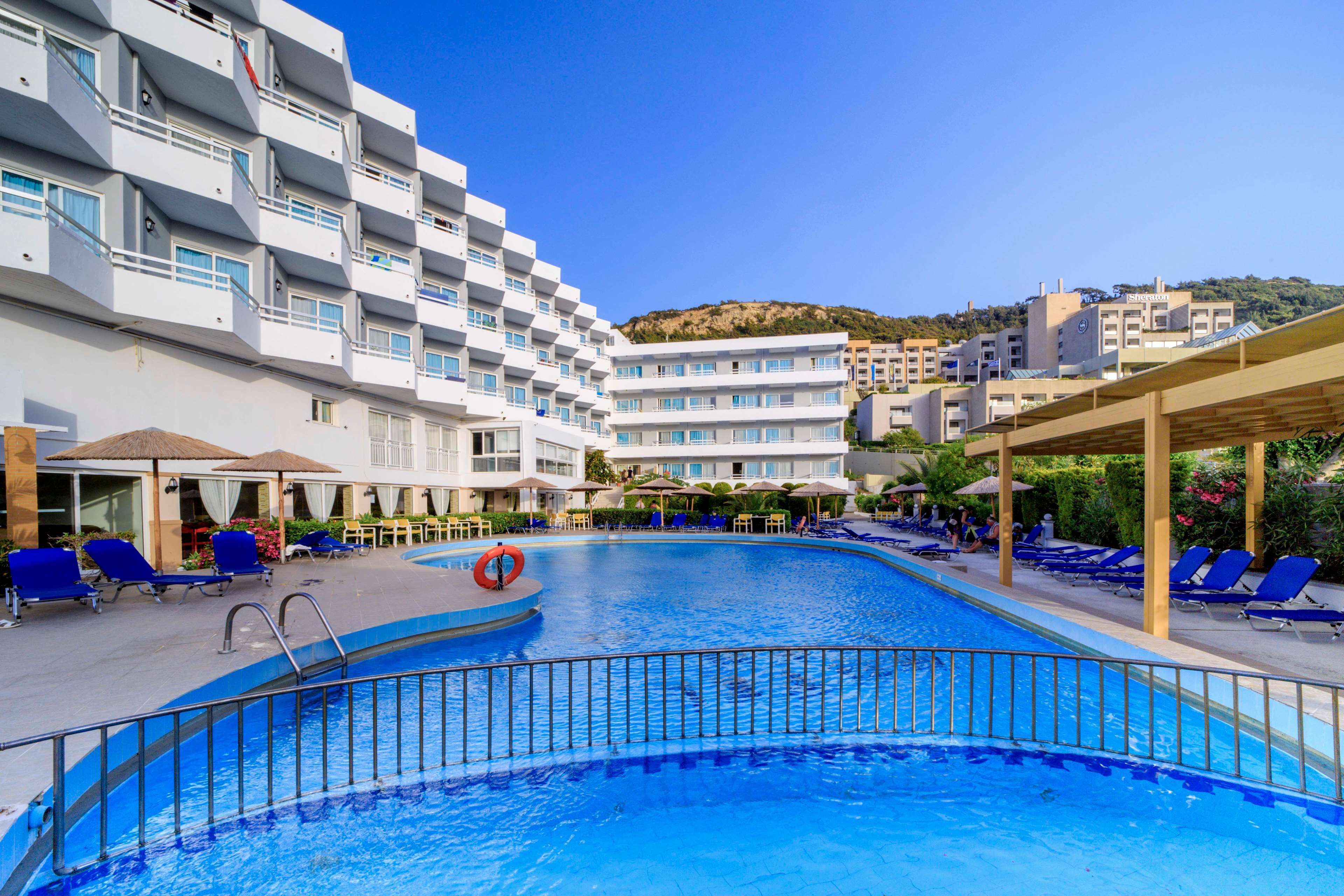 Seasonal outdoor pool, pool umbrellas, pool loungers