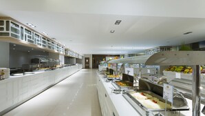 A modern buffet setup with multiple food stations and a clean, spacious layout. - Terrace Elite Resort - All Inclusive (Manavgat)