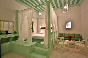 Deluxe Suite | Living area | 32-inch Smart TV with satellite channels, streaming services