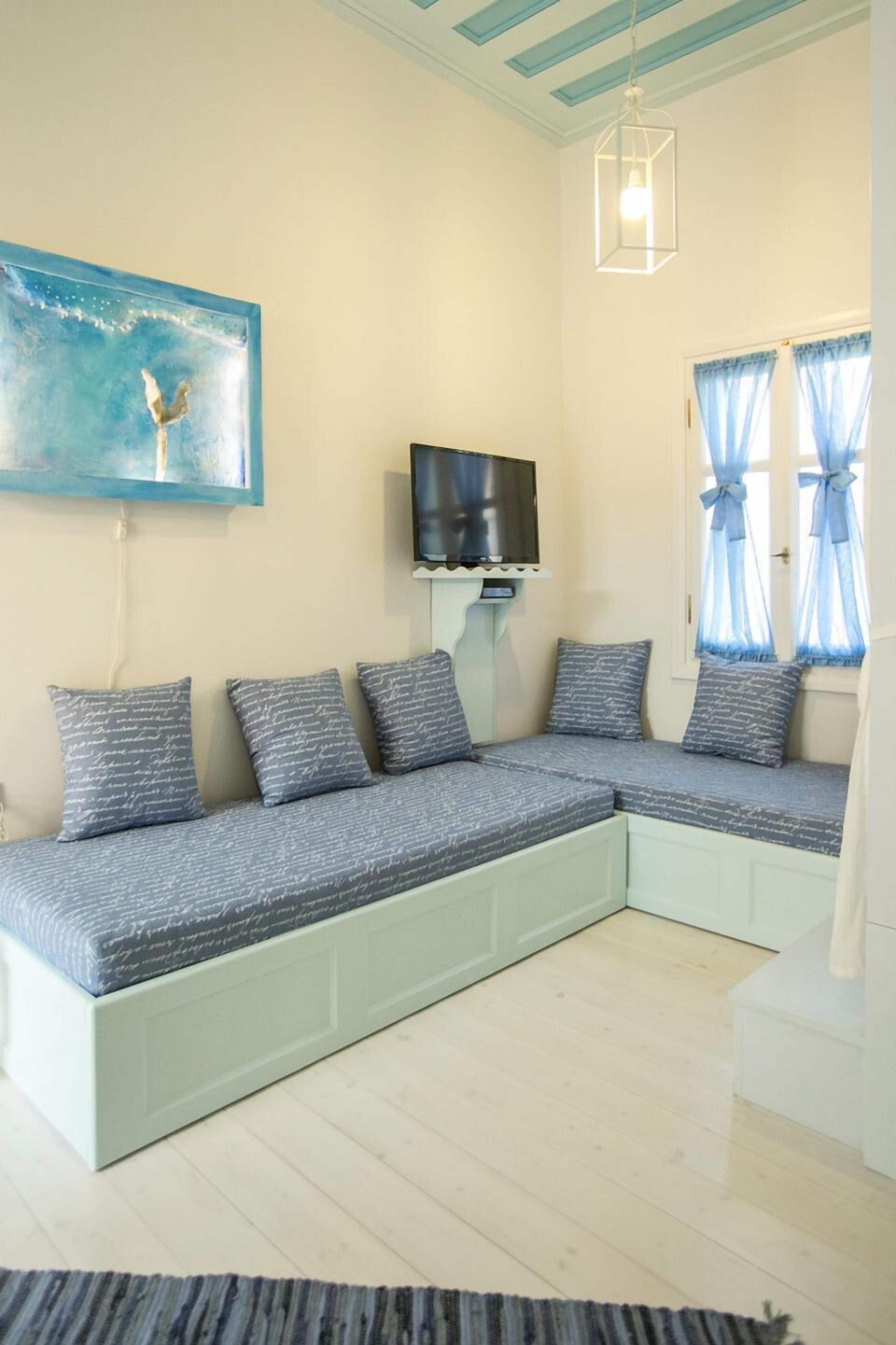 deluxe suite | living room | 32-inch smart tv with satellite channels, streaming services