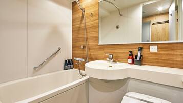 Combined shower/tub, free toiletries, hair dryer, slippers
