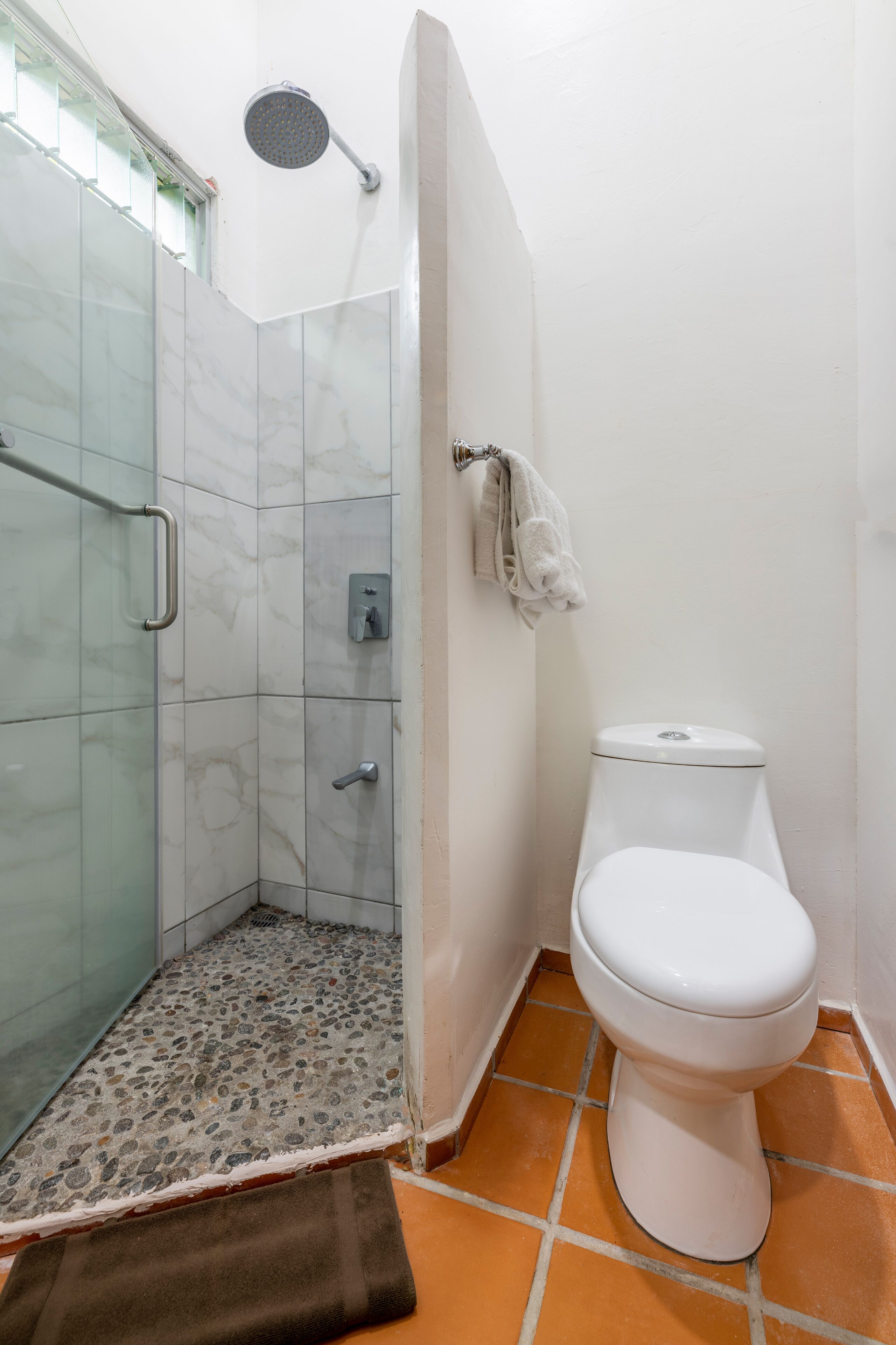 superior bungalow | bathroom | shower, eco-friendly toiletries, hair dryer, towels