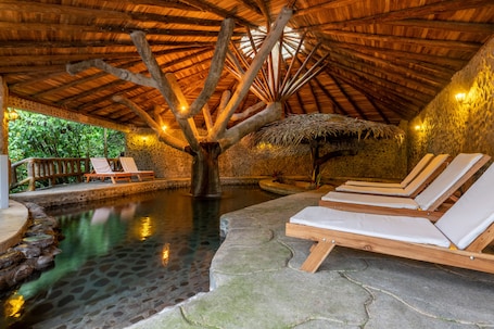 Indoor pool, outdoor pool, pool loungers. Rancho Margot