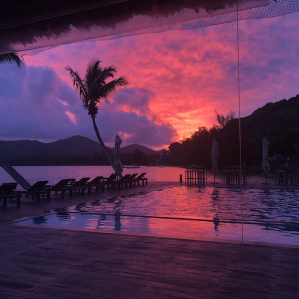 Breakfast, lunch served; local and international cuisine, pool views