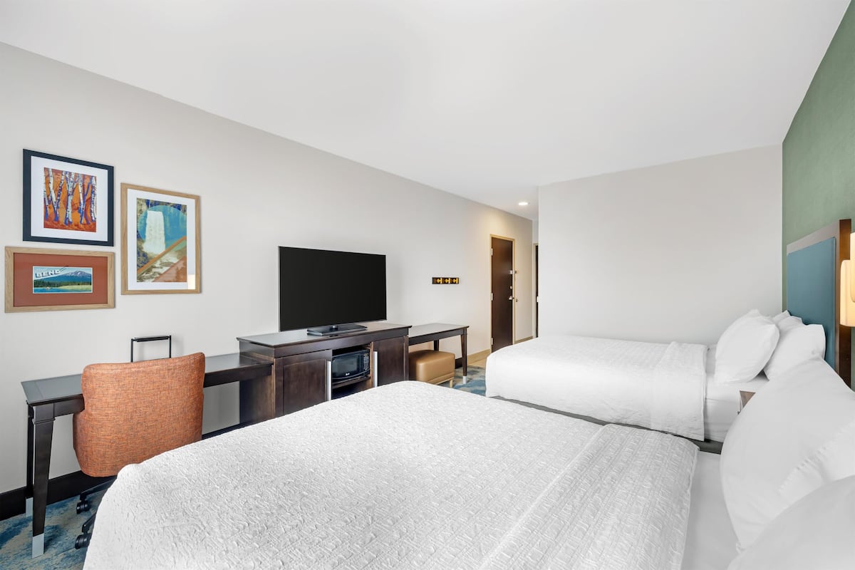 Room, 2 Queen Beds, Refrigerator & Microwave | Blackout drapes, iron/ironing board, free WiFi, bed sheets