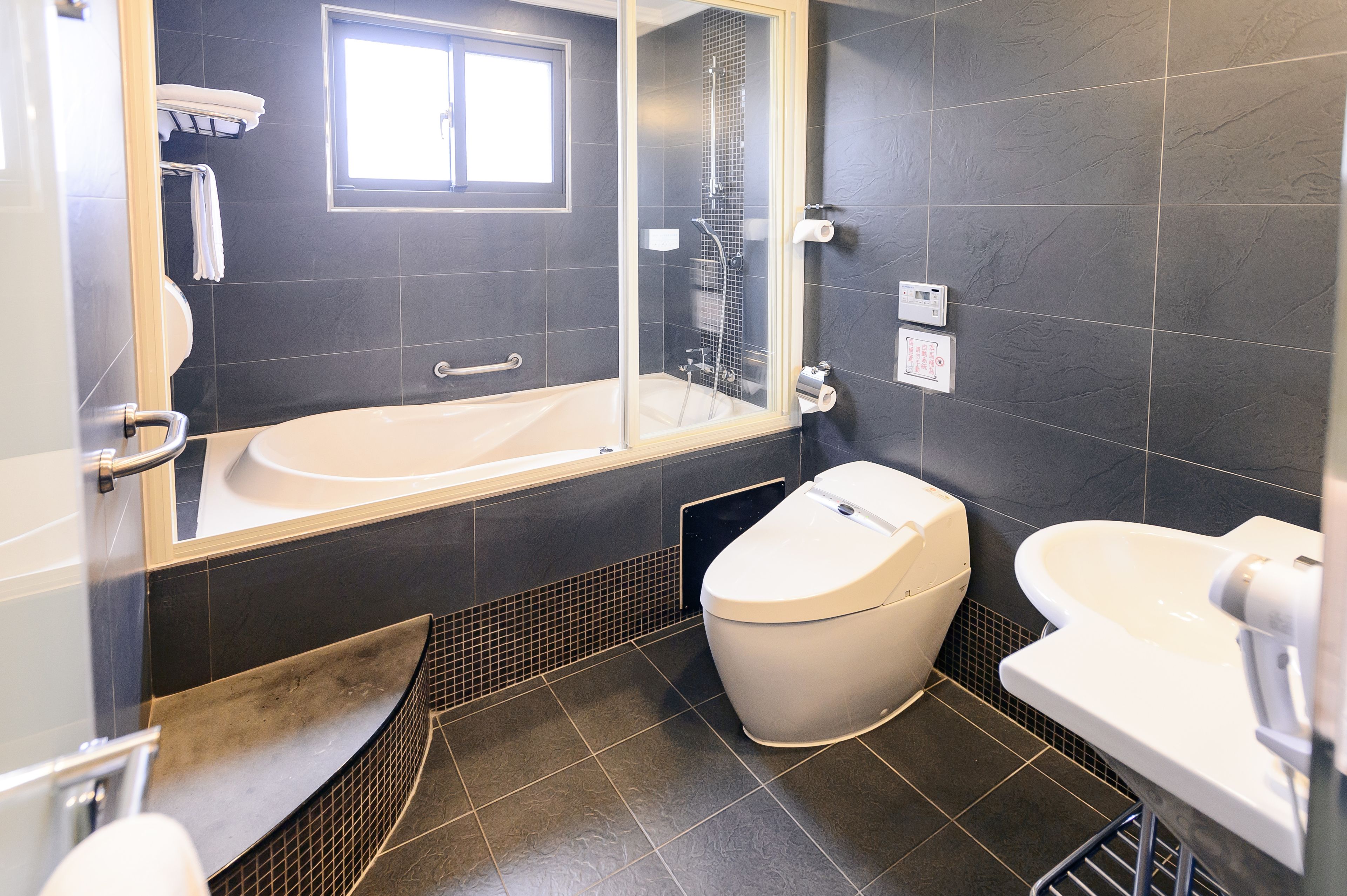 premium double room | bathroom | shower, rainfall showerhead, hair dryer, towels