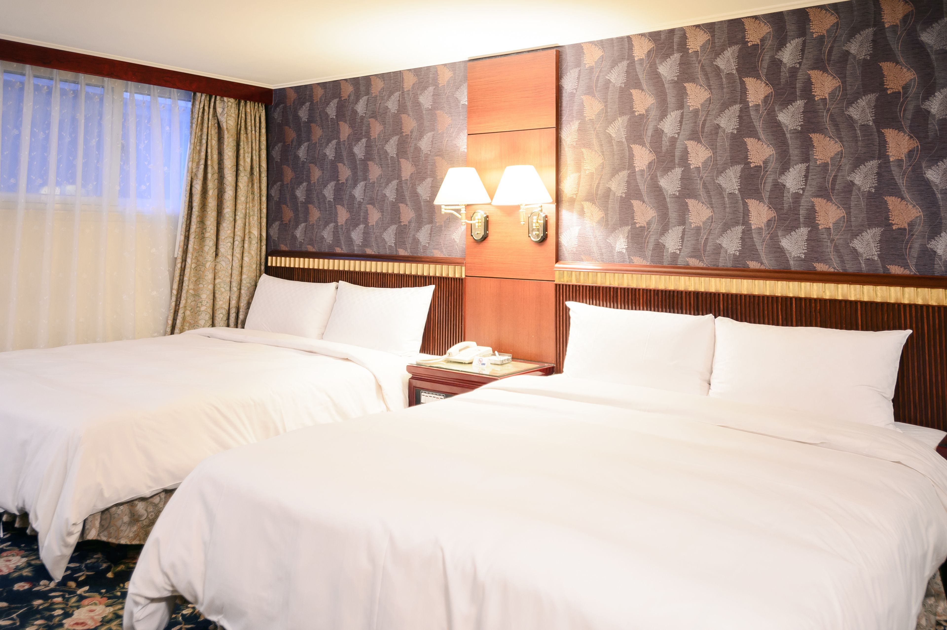 premium quadruple room | down duvets, pillow-top beds, blackout curtains, soundproofing