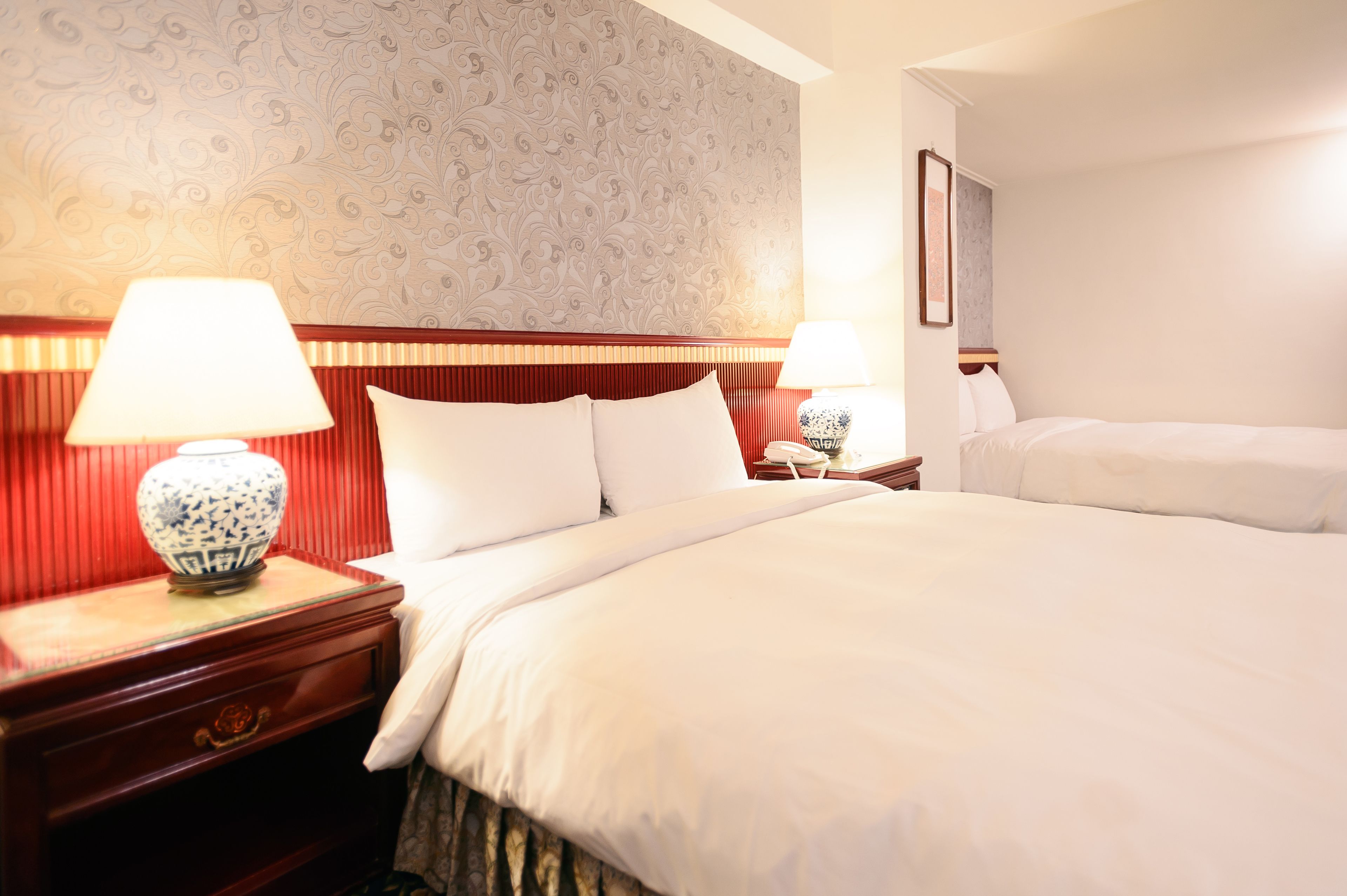 deluxe quadruple room | down duvets, pillow-top beds, blackout curtains, soundproofing