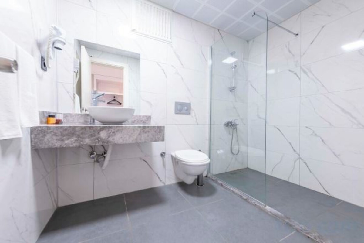 Shower, free toiletries, hair dryer, slippers
