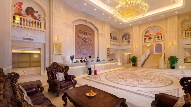 A grand lobby with ornate furniture, a central chandelier, and a large mural. - Vienna International Hotel (Shenzhen Xiashuijing Metro Station) (Shenzhen)