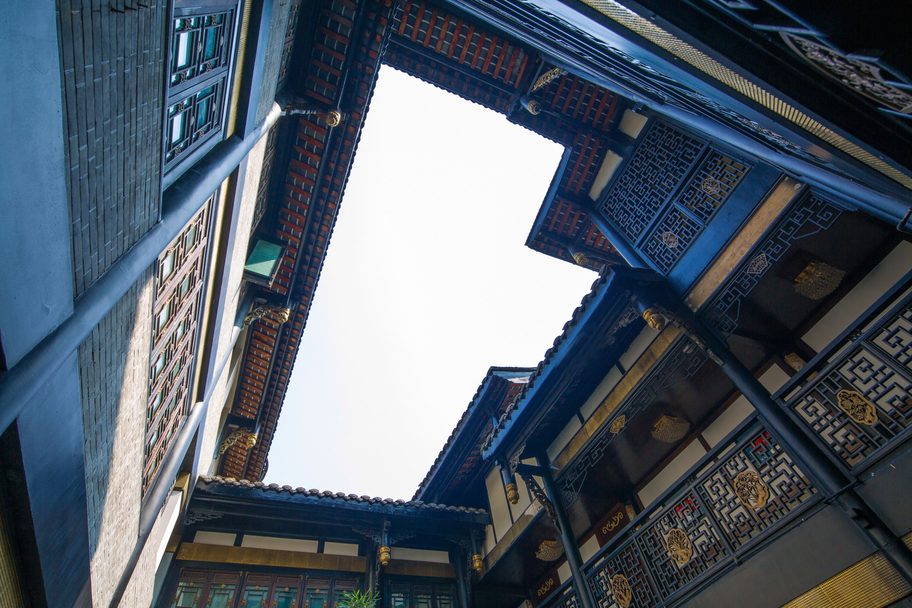 A traditional architectural structure with multiple levels and intricate wooden designs.