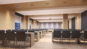A spacious conference room with multiple tables and chairs, wooden flooring, and recessed lighting. - Nanyuan Ejiaplus Hotel (Ninghai Xizi International) (NINGHAI)