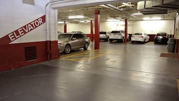 A multi-level parking garage with cars parked on different levels.