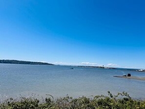 A calm body of water with a distant shoreline and a clear sky. - Anchor Inn Motel (Blaine)