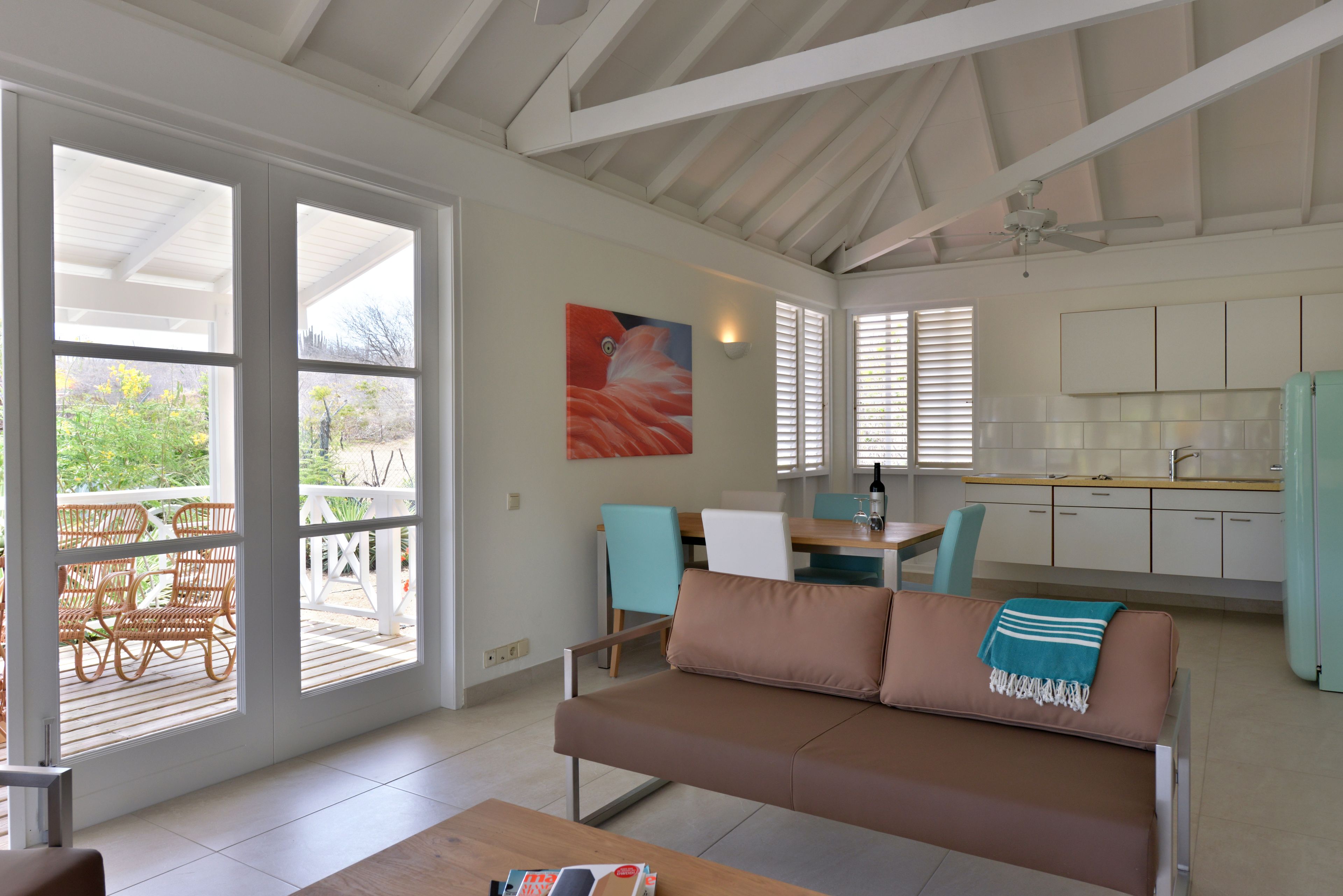 bungalow, 2 bedrooms | living area | 32-inch flat-screen tv with digital channels, tv, books