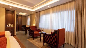 Habitación doble Deluxe | Área de sala de estar