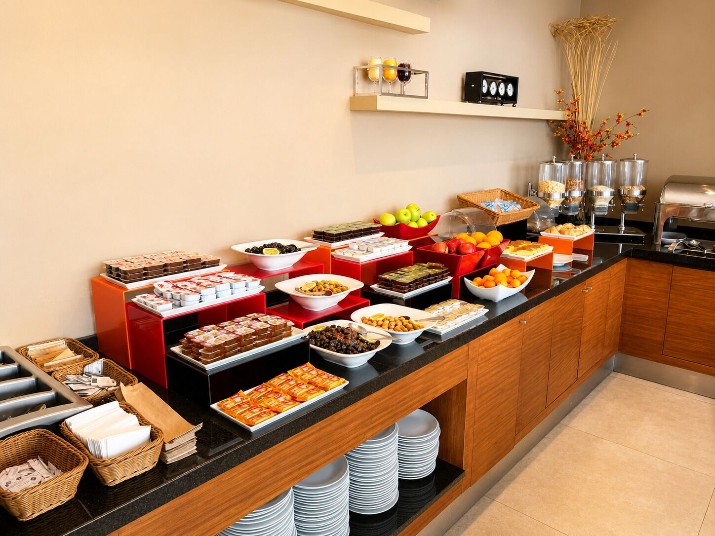 A buffet setup with various food items and condiments.