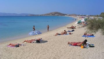 Beach nearby, white sand, beach towels