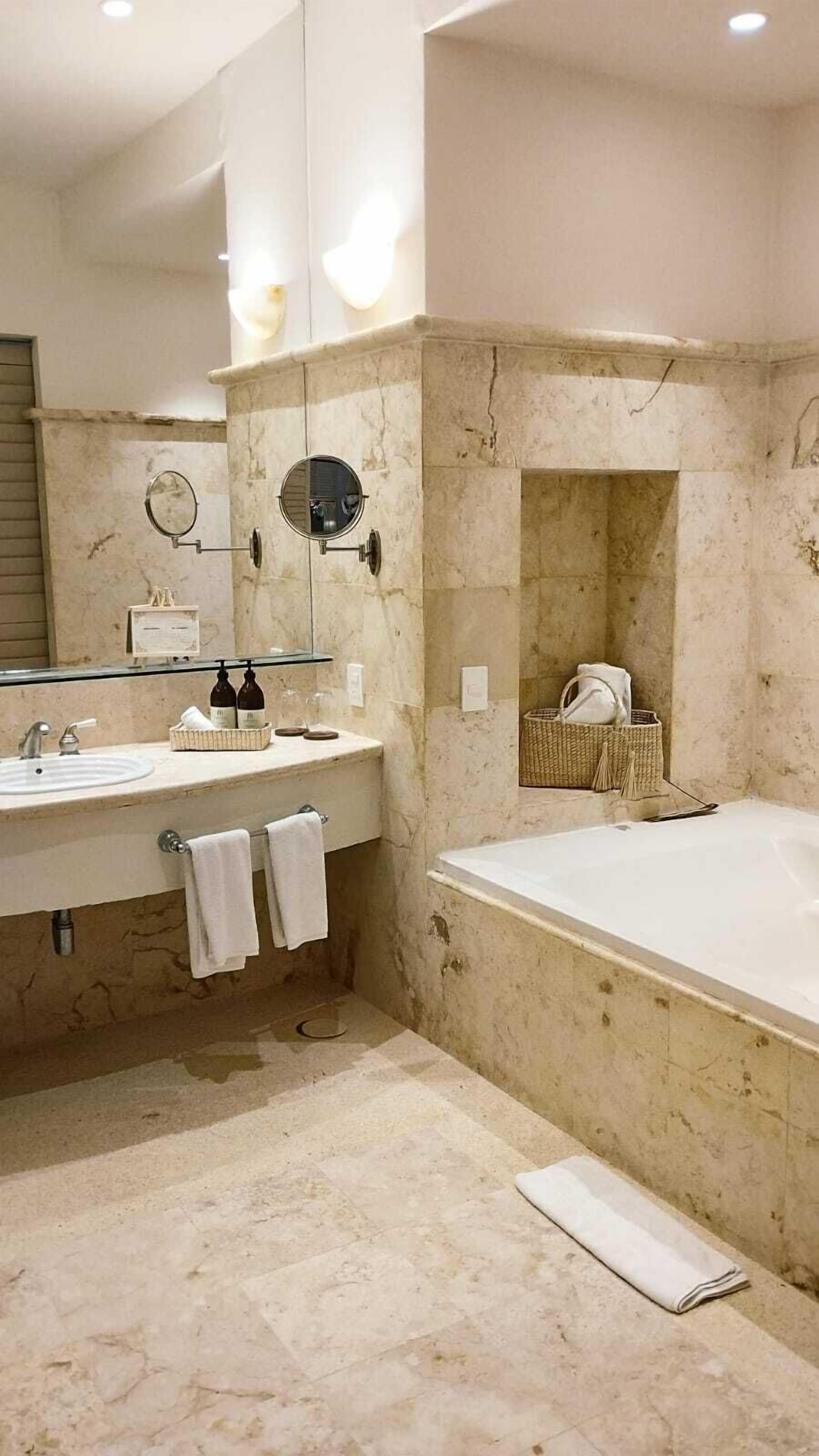 separate bathtub and shower, deep-soaking bathtub, designer toiletries