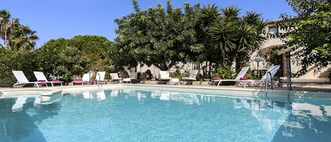 Outdoor pool, open 10:00 AM to 8:00 PM, pool loungers