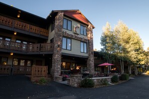 A multi-story building with a stone facade and a sign reading "Silver Moon Inn." - Silver Moon Inn (Estes Park)