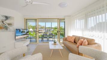 Two Bedroom Waterfront Apartment | Living area | 50-inch flat-screen TV with digital channels, TV