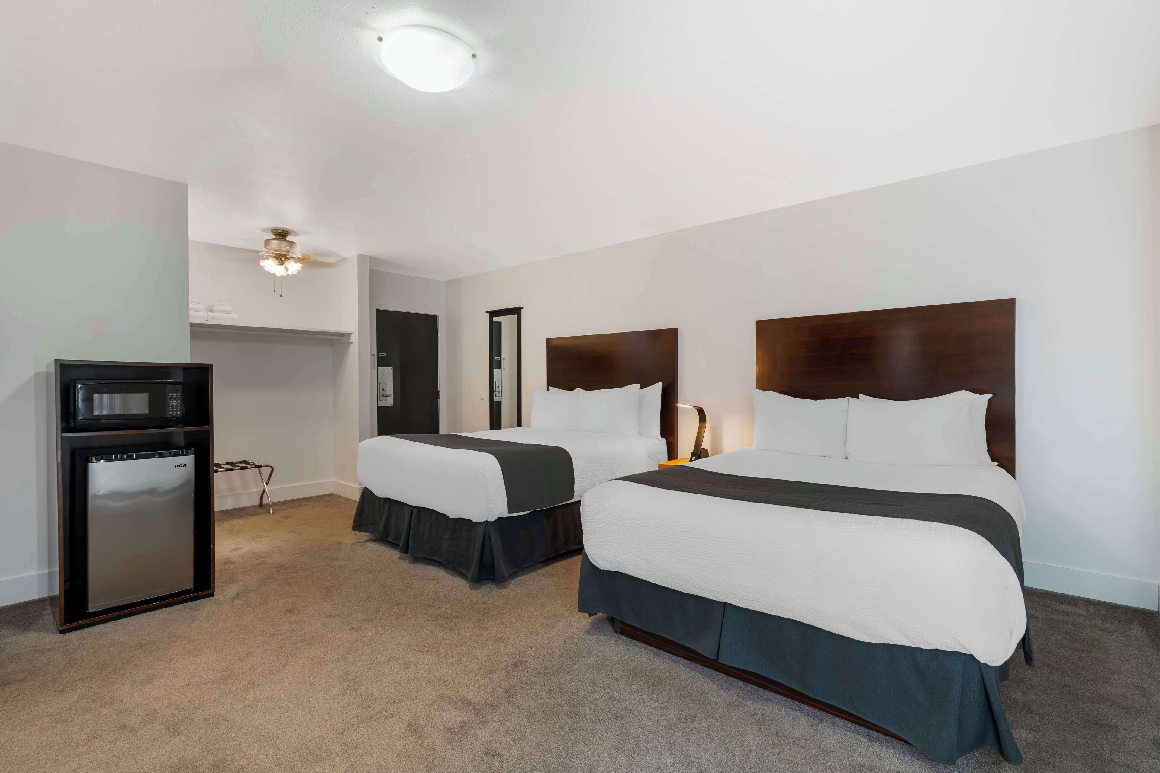 standard room, 2 queen beds, refrigerator & microwave, courtyard view | hypo-allergenic bedding, pillow-top beds, in-room safe, desk