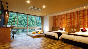 A hotel room with a large window, a wooden floor, two beds, a desk, and a balcony. - Hinotanionsen Misugi Resort (Tsu)