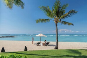On the beach, white sand, free beach cabanas, sun-loungers