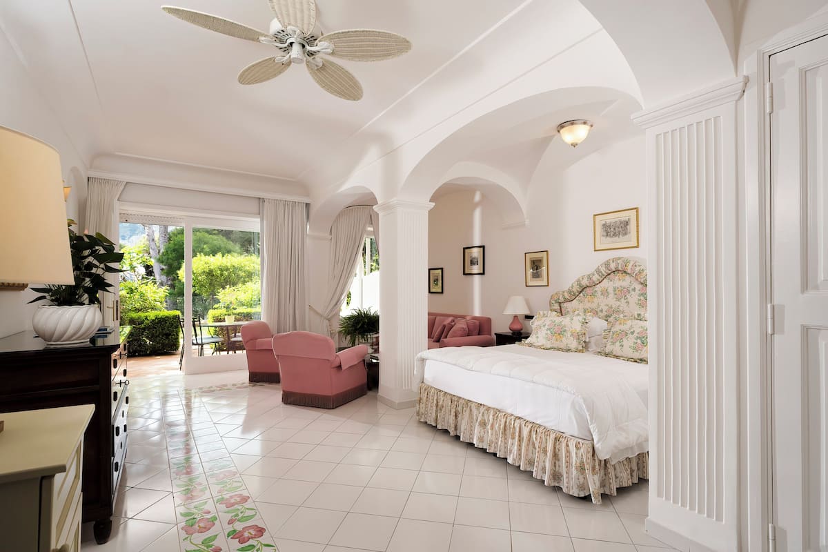 junior suite with patio and garden view | 1 bedroom, premium bedding, minibar, in-room safe