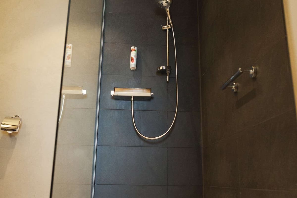 junior suite | bathroom | deep-soaking bathtub, designer toiletries, hair dryer, bathrobes