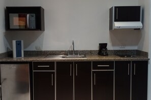 Executive Suite | Private kitchen | Full-size fridge, microwave, stovetop, coffee/tea maker