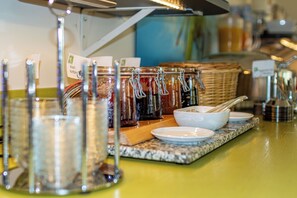 A buffet setup with various food items and serving utensils. - Parkhotel Bad Rehburg (Rehburg-Loccum)