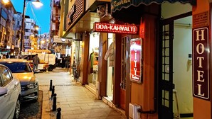 A hotel with a sign reading "HOTEL" and a neon sign for "Oda-Kahvalti" restaurant. - The City Residence (Çanakkale)