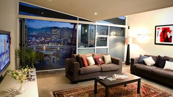 Two Bedroom Penthouse - IXL Apartments | Living area | 40-inch TV with digital channels
