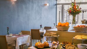 A breakfast buffet with various pastries, bread, and fruits. - Best Western Hotel Du Roy D'aragon (Bonifacio)