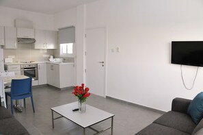 Deluxe Apartment, 1 Bedroom, Pool View | Living room | 32-inch LED TV with satellite channels, TV - Kaos Hotel Apartments (Ayia Napa)
