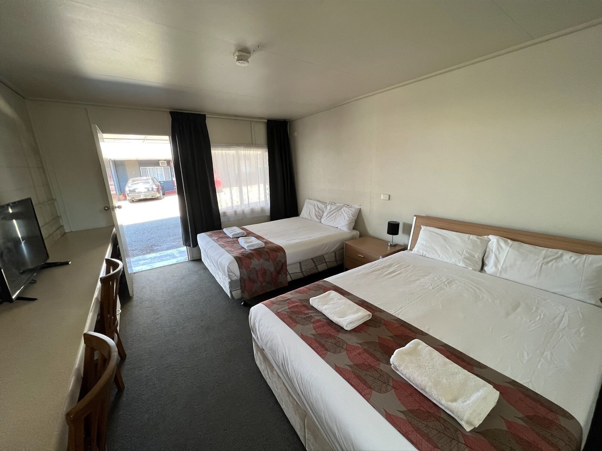 Desk, laptop workspace, blackout drapes, soundproofing