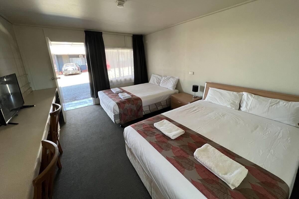 Desk, laptop workspace, blackout drapes, soundproofing