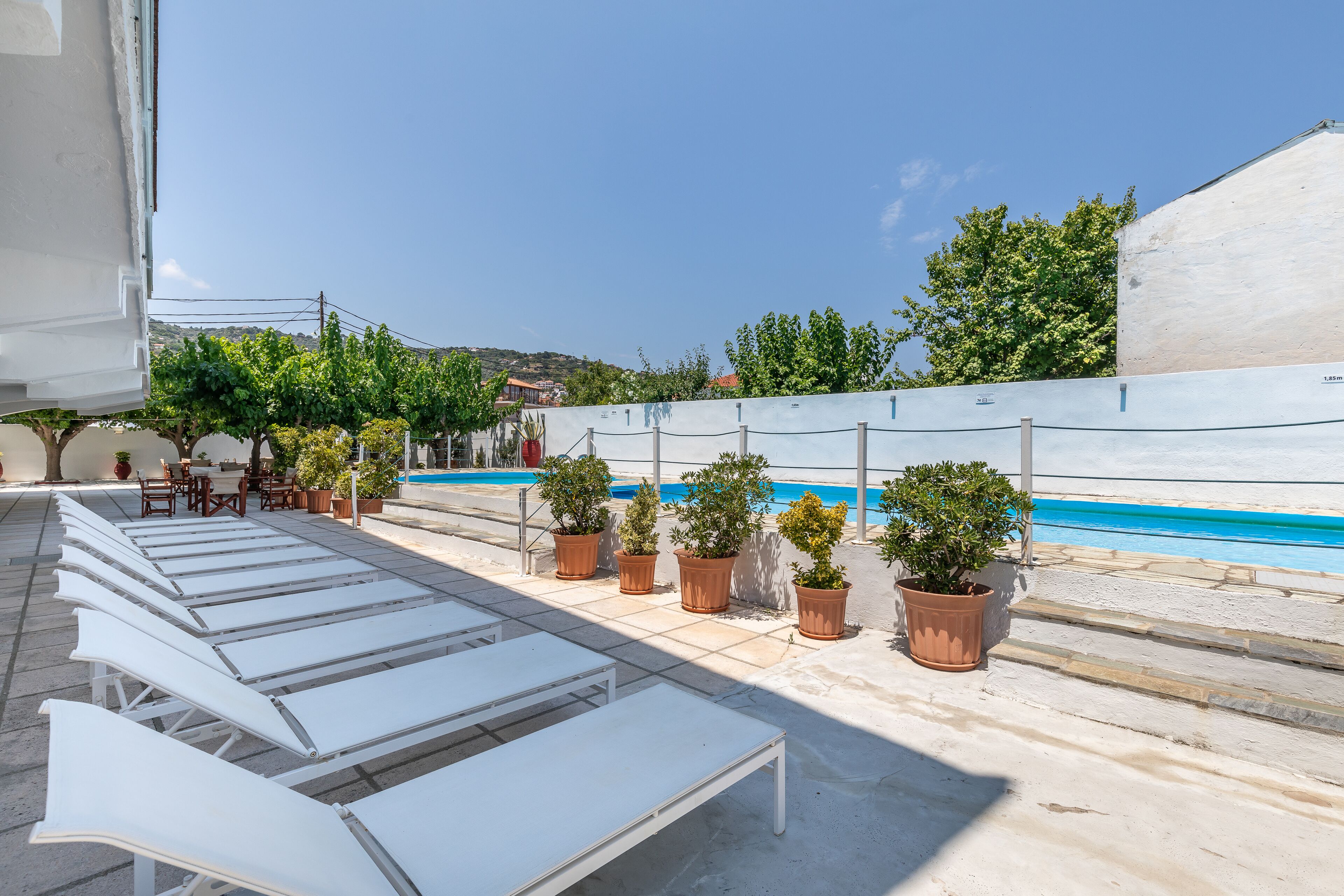 outdoor pool, pool umbrellas, pool loungers