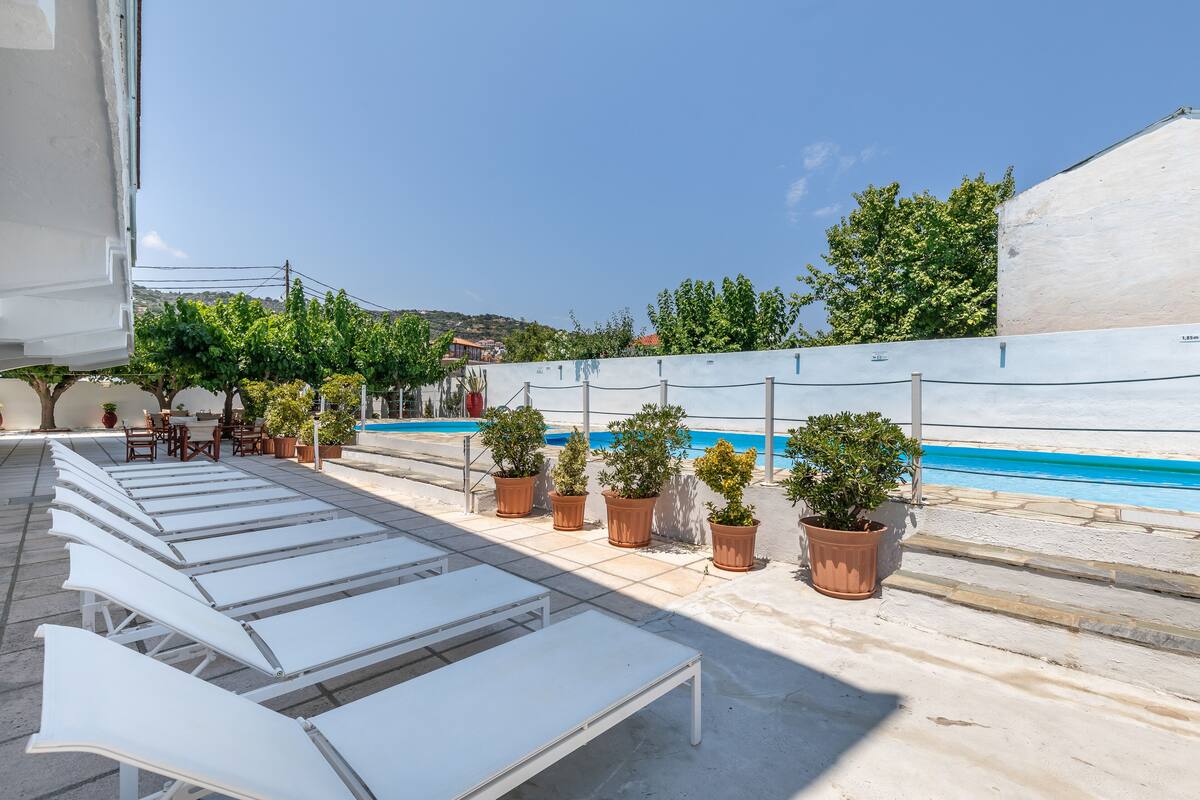 outdoor pool, pool umbrellas, pool loungers