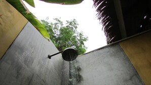 A shower with water flowing from a handheld showerhead. - The Park Drive-Thru Check-In Resort (Thanyaburi)