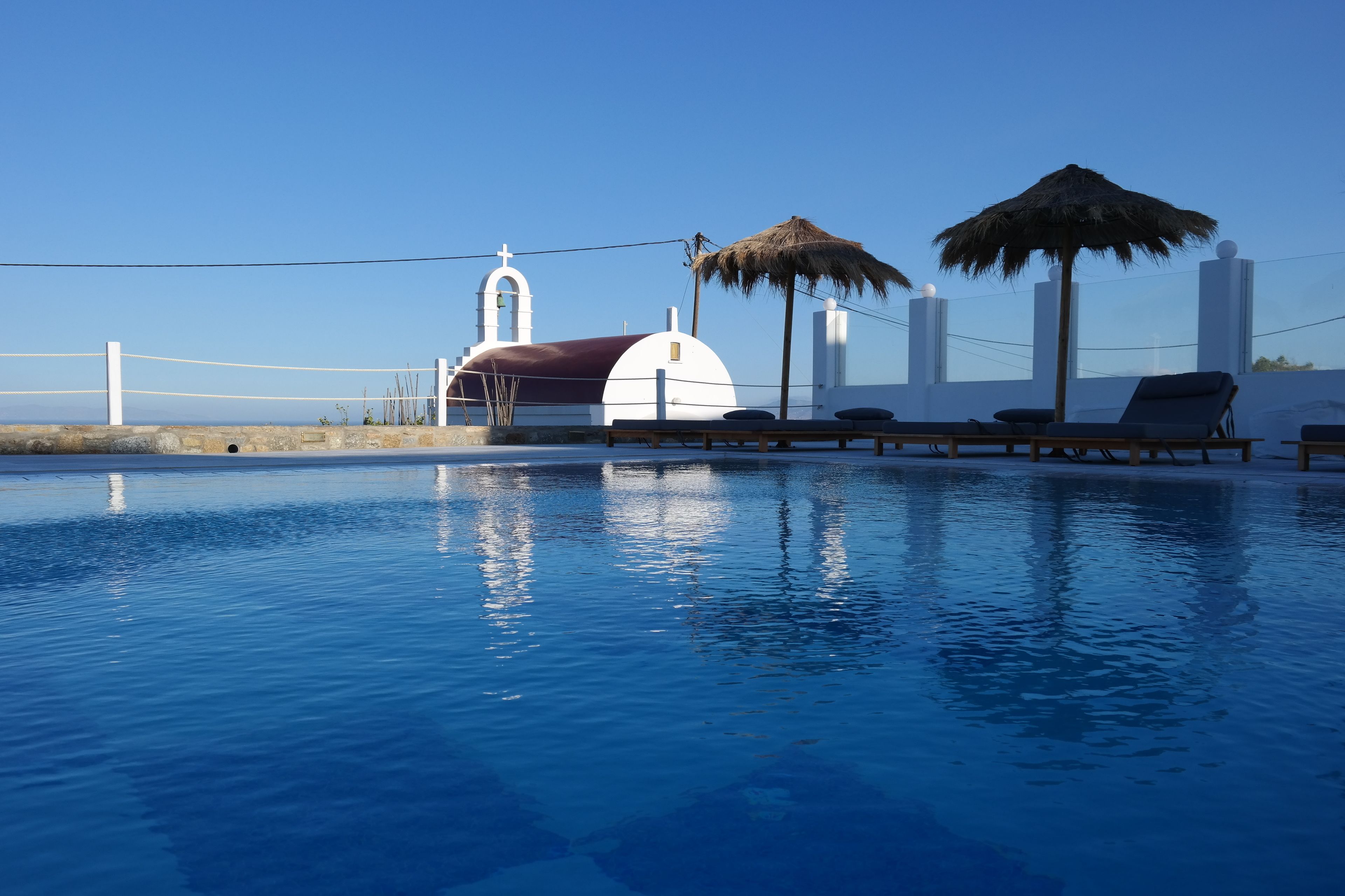 seasonal outdoor pool, open 9 am to 9 pm, pool umbrellas, pool loungers