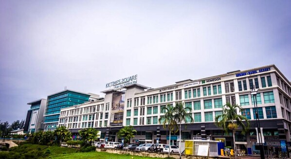 A modern hotel with a prominent sign reading "KKIMES SQUARE." - KK Times Square Hotel (Kota Kinabalu)