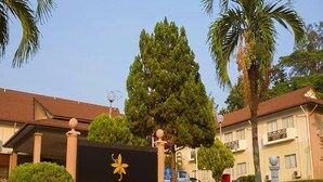 A sign for Hotel Seri Malaysia with a clear view of the building's entrance, palm trees, and a well-maintained lawn. - Hotel Seri Malaysia Port Dickson (Port Dickson)